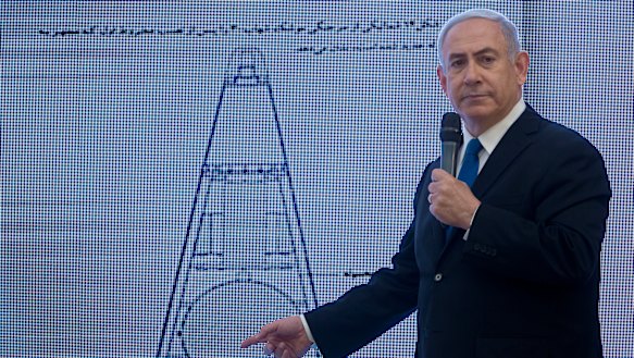 Israeli Prime Minister Benjamin Netanyahu presents material on Iranian nuclear weapons development during a press conference in Tel Aviv last week.