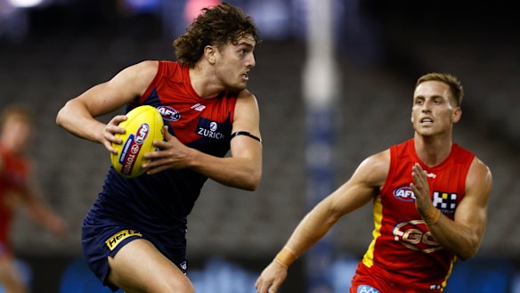 Luke Jackson shows a burst of speed for the Demons.