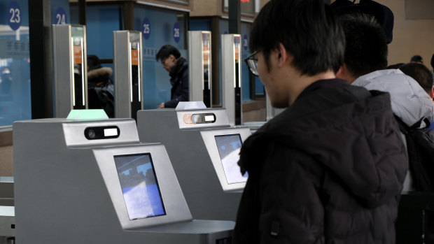 China's monitoring means rail passengers are scanned by face recognition software and are warned over the railway station's PA system to behave or their behaviour will be recorded on their social credit file.