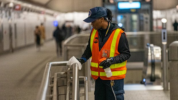 Railings are disinfected at a New York subway station.