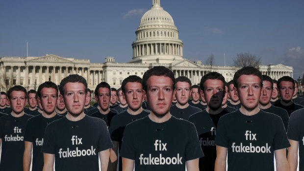 Cardboard cut outs of Mark Zuckerberg welcome him to the US Capitol where he testified for five hours on Tuesday.