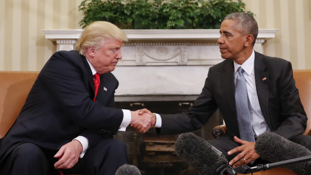 Then President Barack Obama and President-elect Donald Trump shake hands following their meeting in the Oval Office in two days after the 2016 election.
