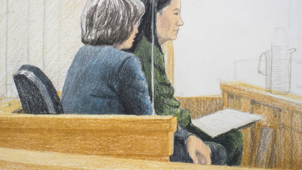 In this courtroom sketch, Meng Wanzhou, right, the chief financial officer of Huawei Technologies, sits beside a translator during a bail hearing at British Columbia Supreme Court in Vancouver.