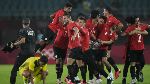 Egypt’s players celebrate their 2-0 victory over Australia.