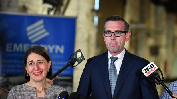 NSW Treasurer Dominic Perrottet and Premier Gladys Berejiklian at a press conference at a small metalwork business in Peakhurst in Sydney on Tuesday.