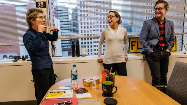 Daly (left) meets with staffers Fernanda Nechio, centre, and Neil Gerstein at her office. 