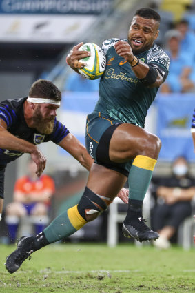 Australia’s Samu Kerevi breaks the tackle of Argentina’s Marcos Kremer.