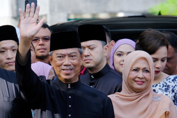 Muhyiddin Yassin, Malaysia's new prime minister waves to members of the media ahead of the swearing in ceremony on Sunday.
