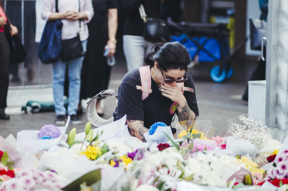 Grief stricken Sydneysiders continued to place wreaths outside Westfield Bondi Junction during a community reflection day.