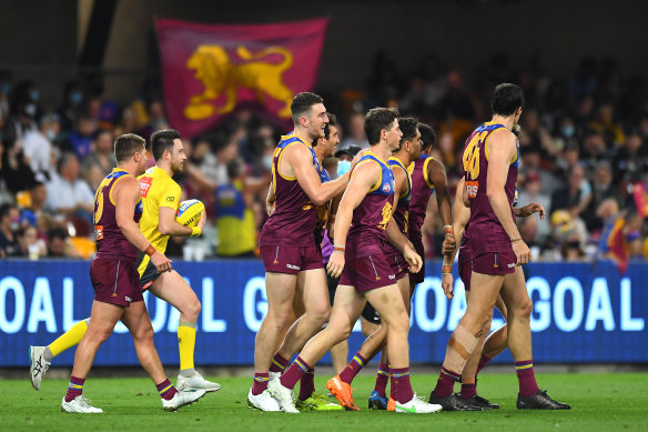 Brisbane Lions players celebrate a goal on their way to victory over Collingwood on the weekend. 