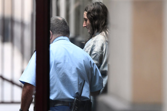 Ben Wardlaw (right) is led away from the Supreme Court of Victoria on Friday after being found guilty of murder.