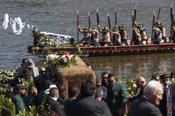 The coffin with the body of New Zealand’s Maori King, Kiingi Tuheitia Pootatau Te Wherowhero VII, is carried after being transported on a waka (a traditional canoe) for burial in Ngaruawahia.
