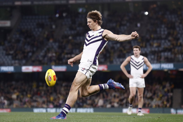 Nat Fyfe of the Dockers kicks for goal during the round 19 AFL match between the Richmond Tigers and the Fremantle Dockers.