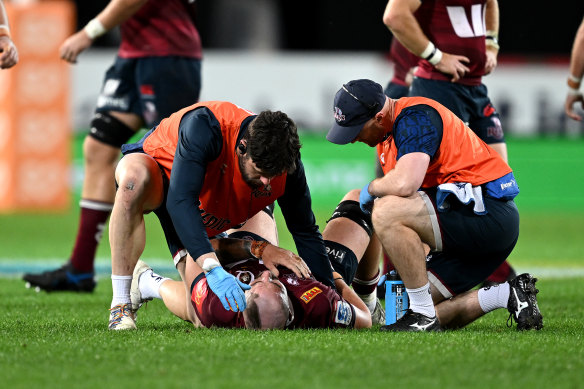 Queensland’s Connor Vest receives medical assistance on Friday.