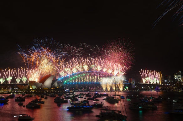 Sydney Harbour Bridge lights up with fireworks on New Year’s Eve.