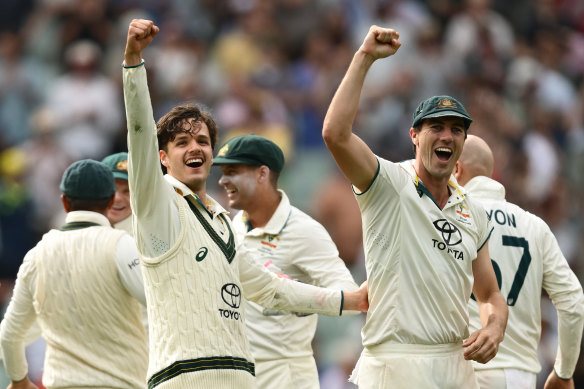 Konstas and Cummins celebrate Australia’s victory on Monday.