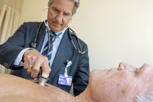 James Thomas, a cardiologist at Northwestern Hospital in Chicago, examines Dennis Calling, a retired inspector. With medical advances and competing devices over the past few decades, "the old stethoscope is kind of falling on hard times", Thomas says.