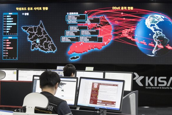 Employees watch electronic boards to monitor possible WannaCry ransomware cyber attacks at the Korea Internet and Security Agency in Seoul, South Korea.