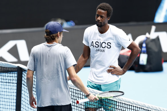 Gael Monfils and Alex de Minaur are free to mingle on the practice court on Saturday.