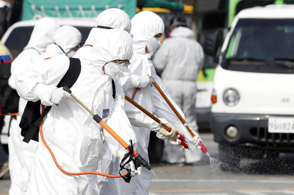 Concerted action: A bus is disinfected in South Korea.