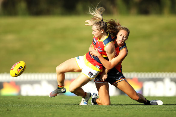 Crows star, Irish import Ailish Considine, is tackled by Giant Tarni Evans.