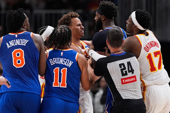 Tough guys: Australian star Dyson Daniels and New York Knicks center Mitchell Robinson get close in game six of their playoff series. Both men were thrown out.