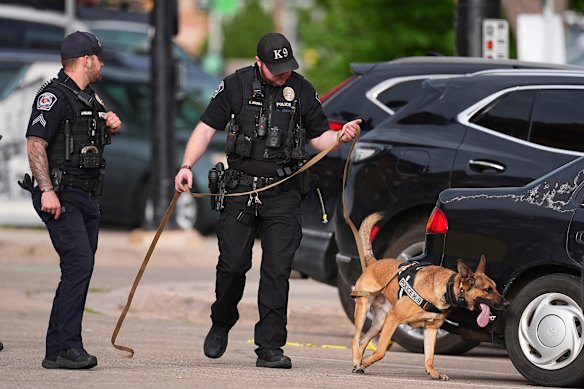 Law enforcement officers investigate after the attack.