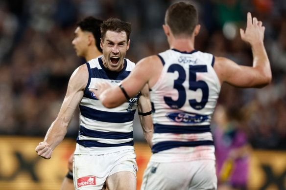 Jeremy Cameron (left) and Patrick Dangerfield of the Cats celebrate a goal.