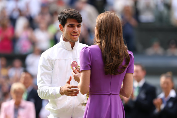 Catherine, Princess of Wales, presents Carlos Alcaraz with his trophy after he beat Novak Djokovic in the men’s singles final.