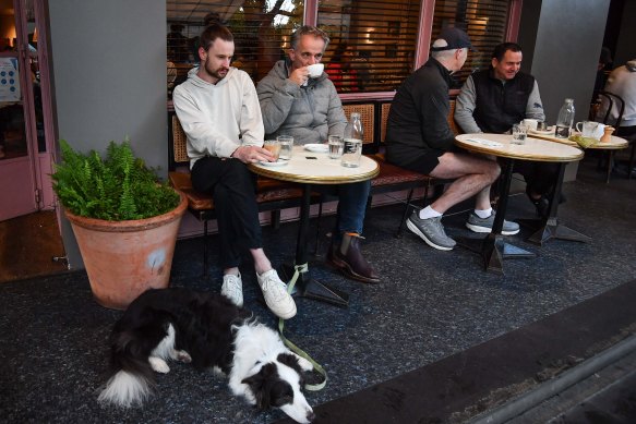 George and Peter Larsen sit down for a coffee at Gilson in South Yarra after restrictions eased overnight.