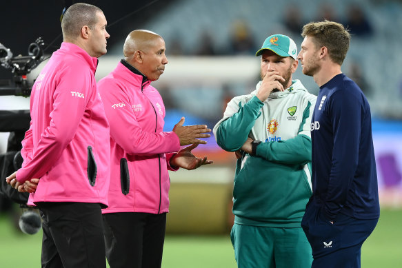 Aaron Finch and Jos Buttler talk to the umpires.