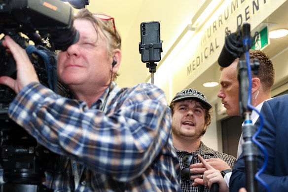 Far-right figure Laurence McIntyre (in cap), heckles Treasurer Jim Chalmers and Prime Minister Anthony Albanese.