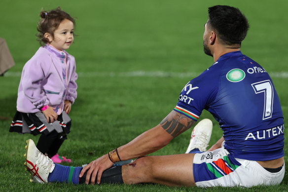 Shaun Johnson with his daughter after defeating the Cowboys earlier this year.