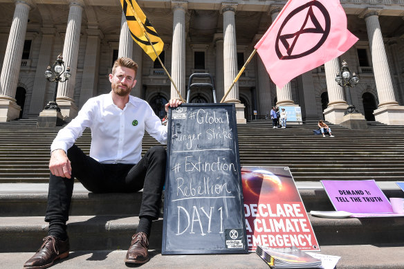 Extinction Rebellion hunger striker Dan Bleakley on the steps of Parliament in Melbourne.