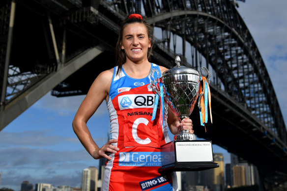 Sidelined Swift Maddy Proud will be hoping to hold the Super Netball trophy again come Sunday.