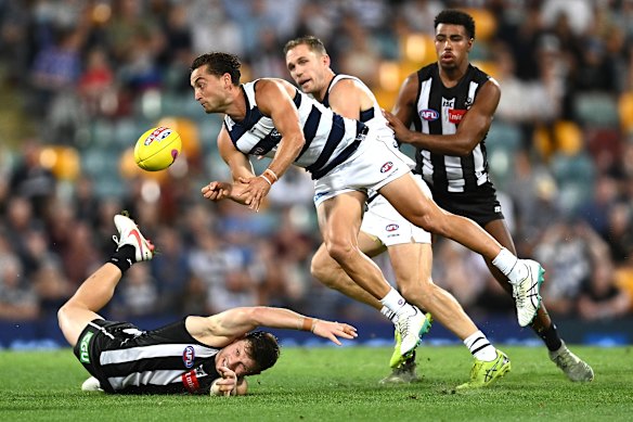 Luke Dahlhaus gets a handball away against the Pies.