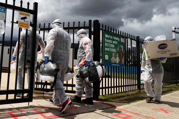 Cleaners arrive at the Malek Fahd Islamic School in Hoxton Park in October 2020.