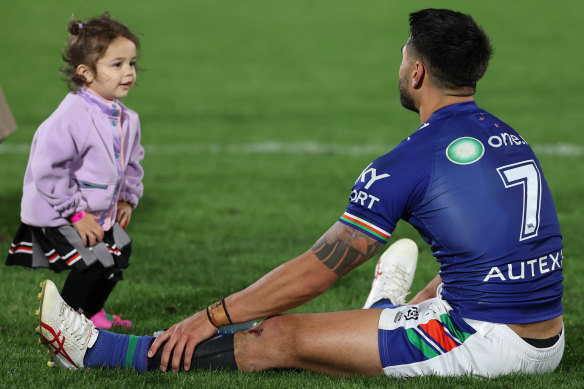 Shaun Johnson with his daughter after defeating the Cowboys earlier this year.