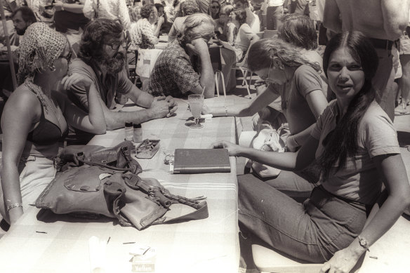 Jim Cairns (centre, face obscured) and Junie Morosi (far right) by the pool at the 1975 ALP conference in Terrigal.