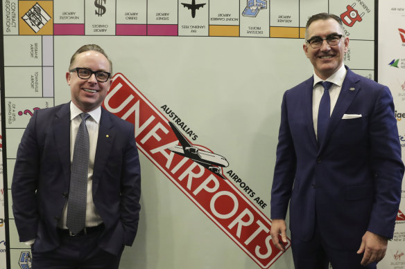 Paul Scurrah (right) with Qantas CEO Alan Joyce at the National Press Club last year. Ratings agencies are concerned about Australia's "duopoly-like domestic market structure".