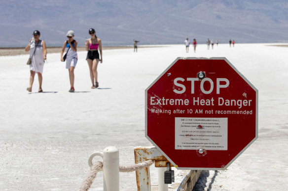 A stop sign warns tourists of extreme heat at Badwater Basin.