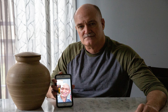 Russell Blatt shows a photo of his brother, Stacy, who donated more than he intended to former President Donald Trump’s 2020 re-election campaign and later died of cancer in February of 2021.