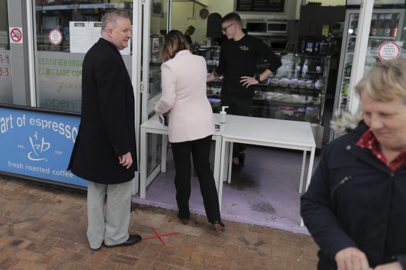 Kristy McBain steps in to pay for the coffee after Anthony Albanese left his wallet in the car.