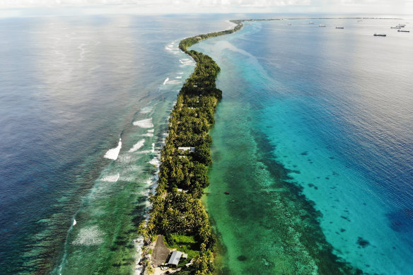 A strip of land between the Pacific Ocean (left) and lagoon in Funafuti, Tuvalu. The low-lying South Pacific island nation of about 12,000 people has been classified as “extremely vulnerable” to climate change by the UN.