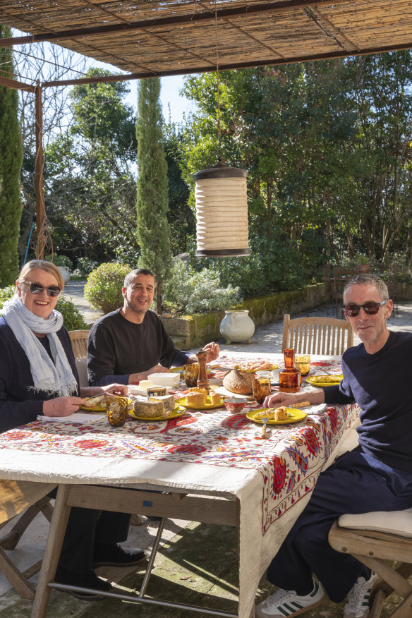 The author enjoying lunch with Khaddar and Grant in the garden.
