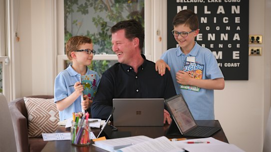 Officeworks general manager finance Justin McKernan (with sons Hamish, left, and William), has enjoyed the extra time with family working from home.