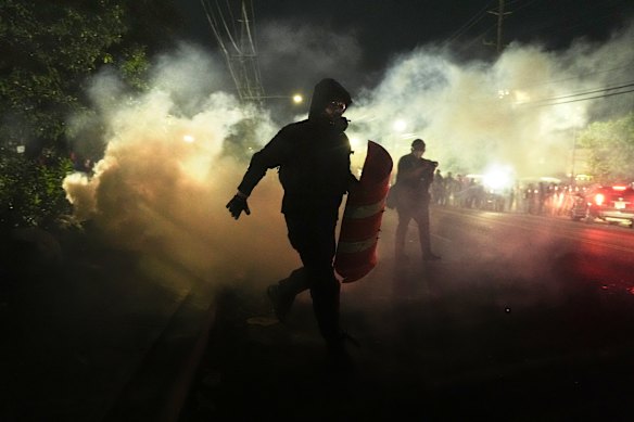 Anti-ICE protesters disperse during clashes with law enforcement officers outside the Delaney Hall detention centre  in Newark, New Jersey.