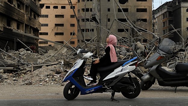 Manessa Ali, 10, surveys the damage in Dahiyeh, Beirut, in the aftermath of the October 5 Israeli strike on a medical facility on the airport road.