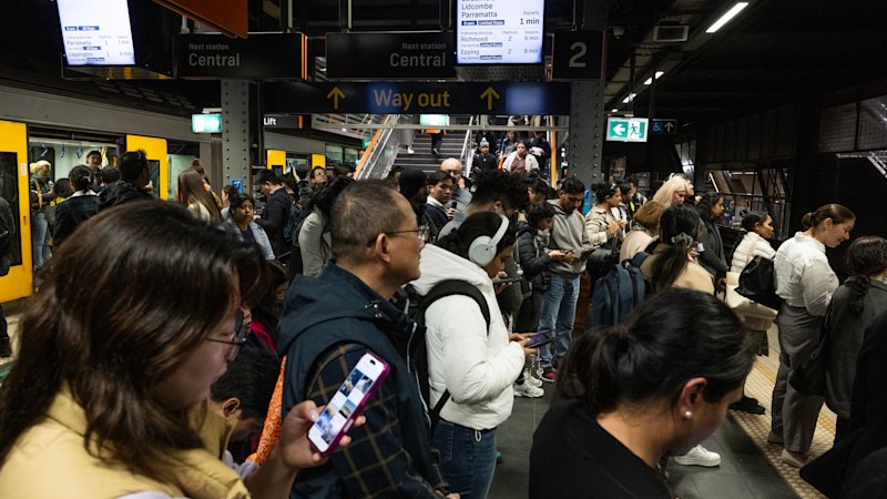Sydney train delays as it happened: Commuters face chaos as power outage at Strathfield halts services; Transport for NSW defends maintenance of live wires