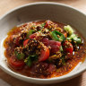 Raw tuna with tomatoes, cucumber, tahini and garlicky chilli oil at Rafi in North Sydney.